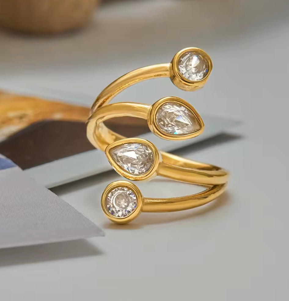 18 k forgyldt, åben ring i stål med zirkoner