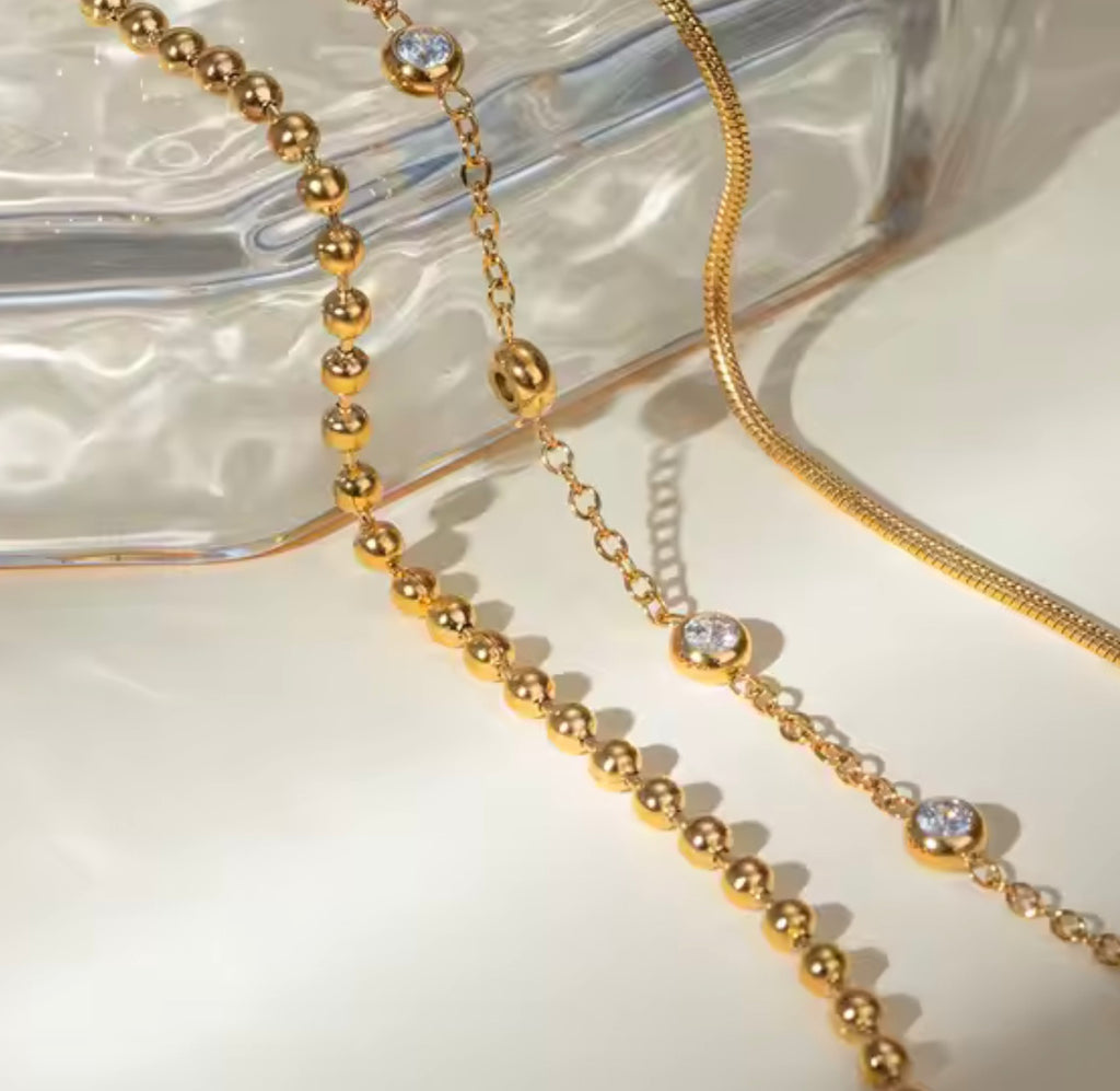 18 karat forgyldt armbånd i stål med zirkoner