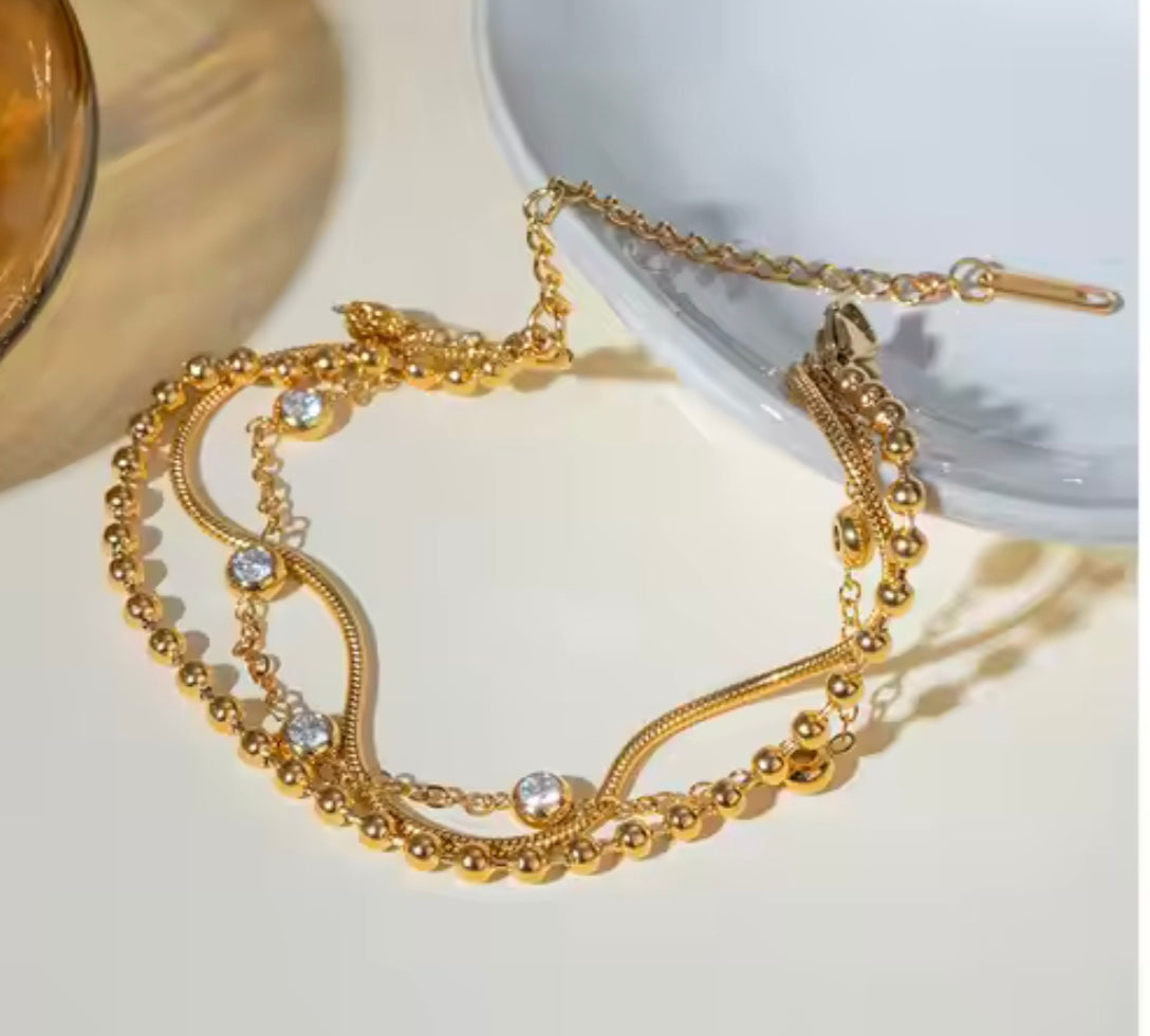 18 karat forgyldt armbånd i stål med zirkoner