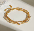 18 karat forgyldt armbånd i stål med zirkoner