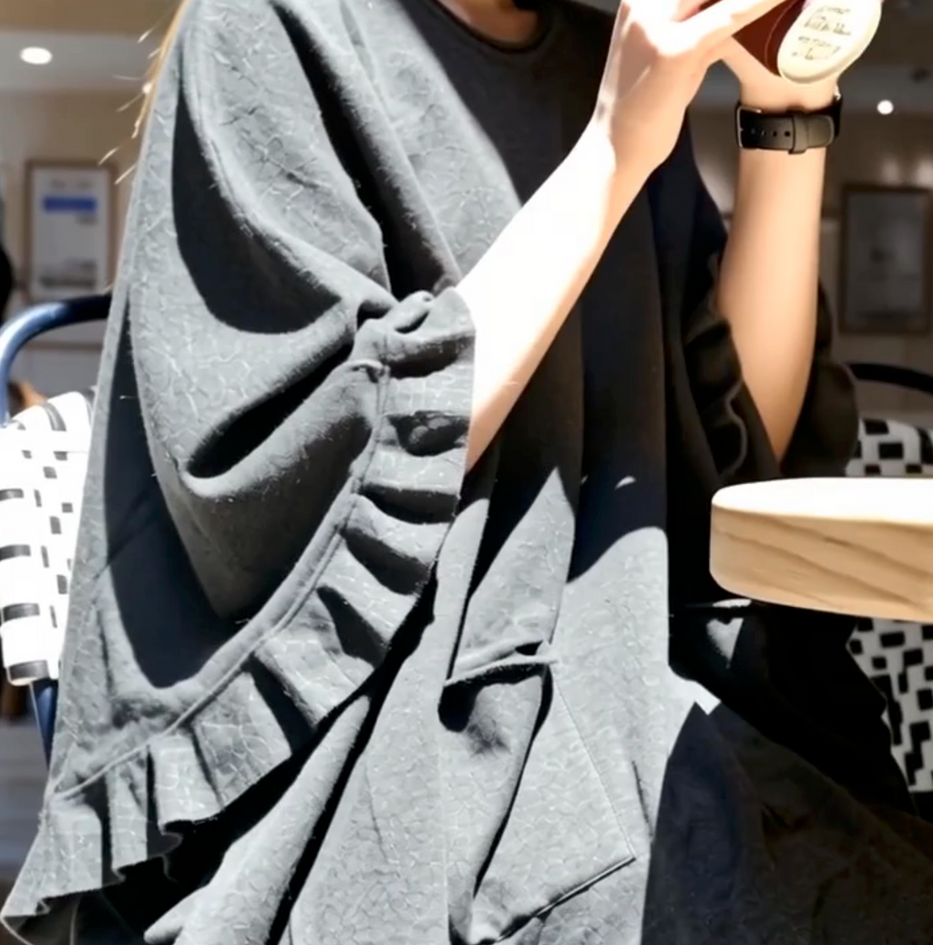 Poncho med flæse