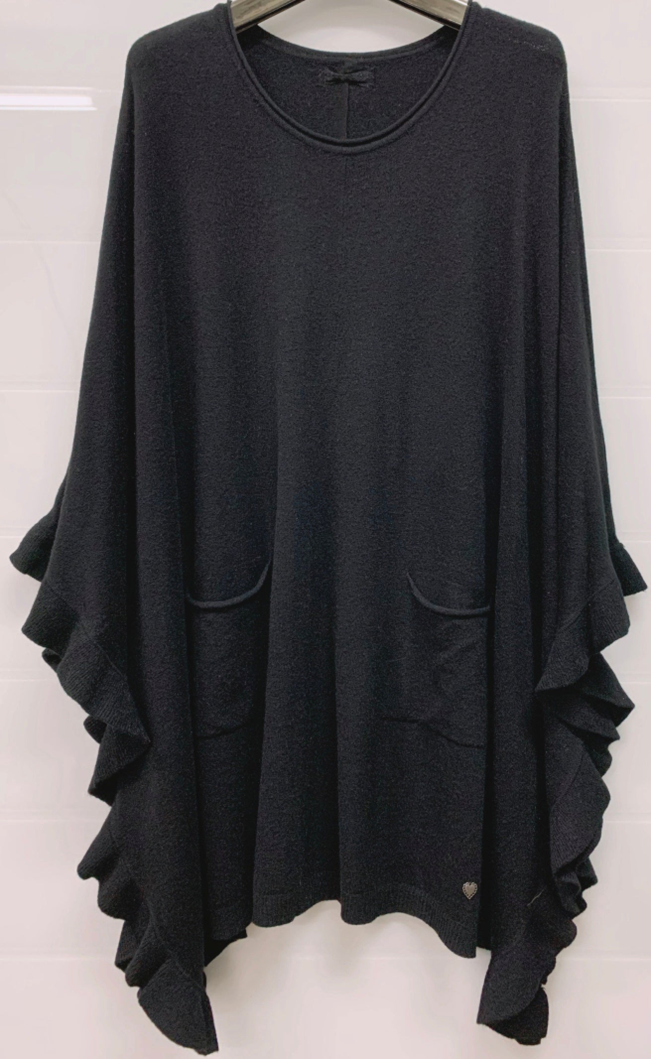 Poncho med volang