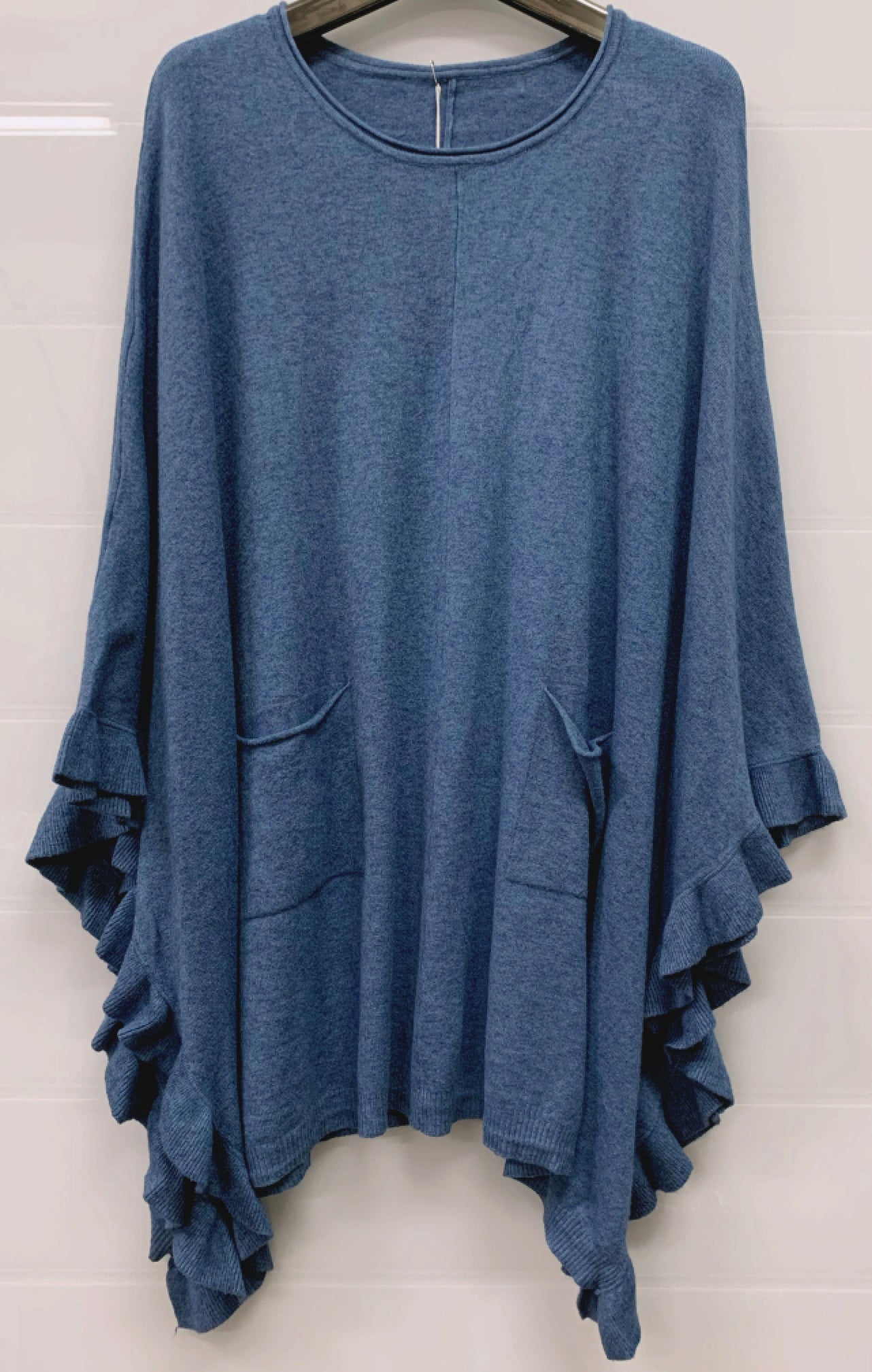 Poncho med volang