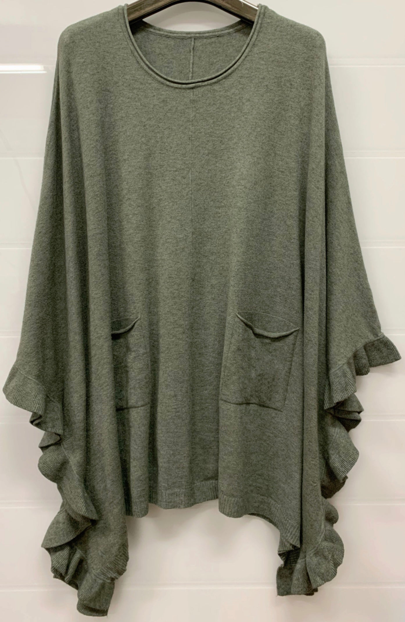 Poncho med volang