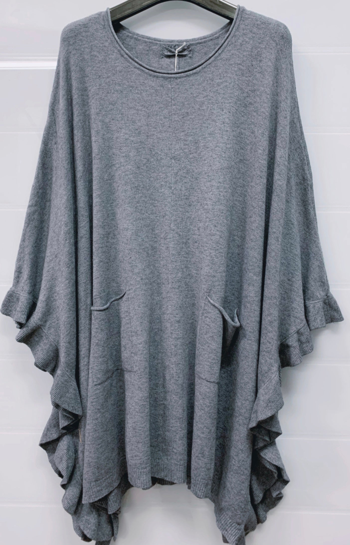 Poncho med volang