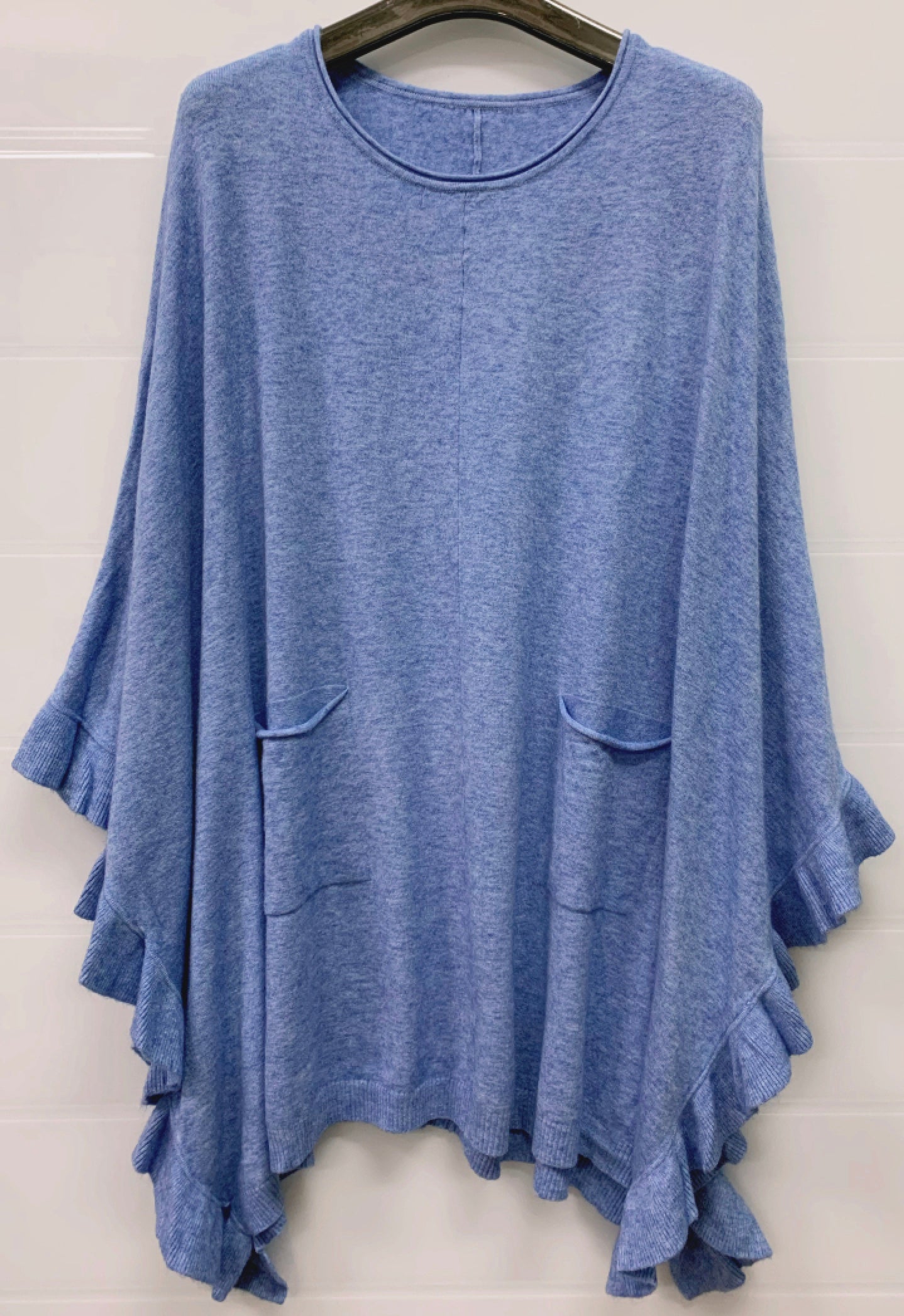 Poncho med volang