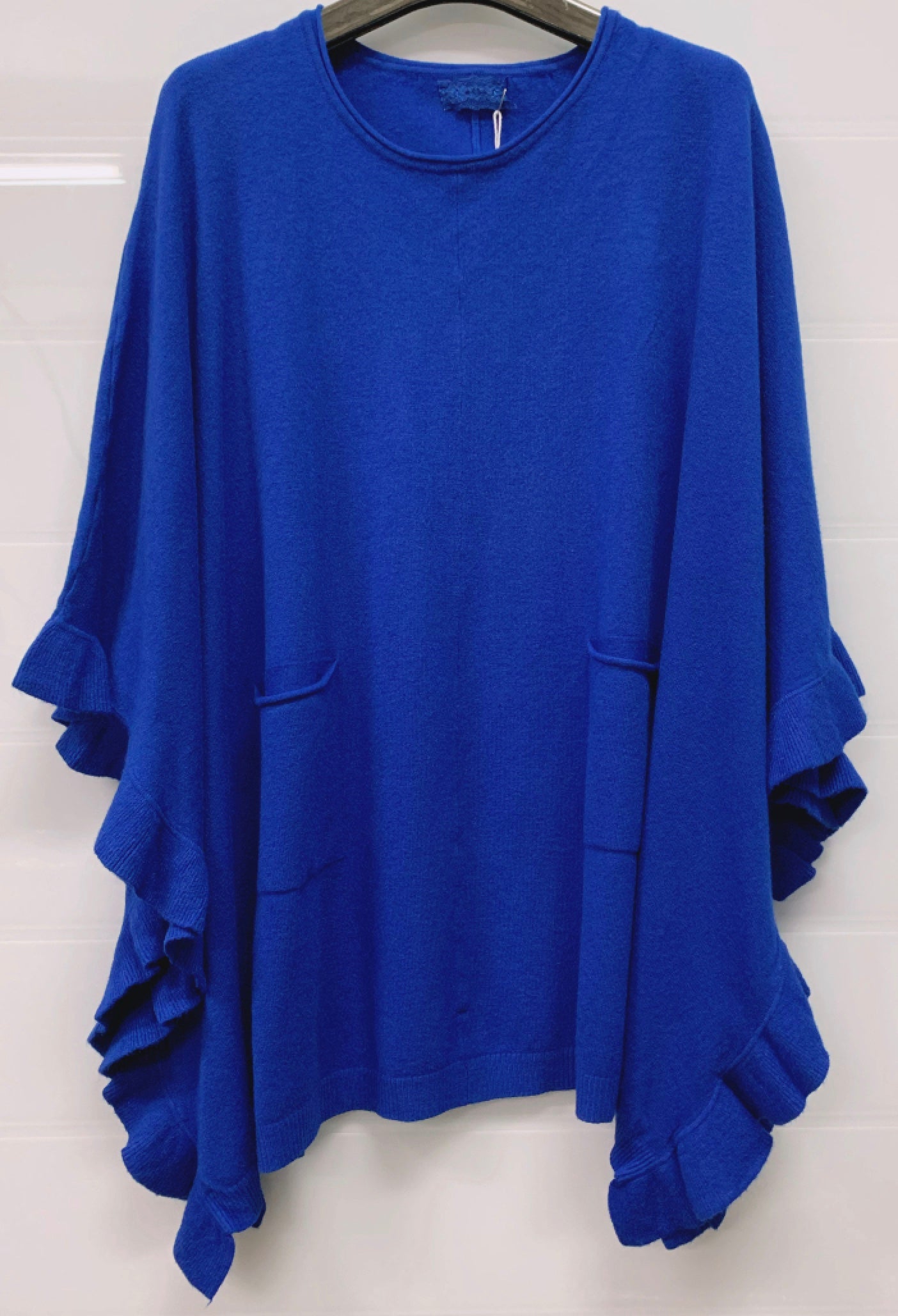 Poncho med volang