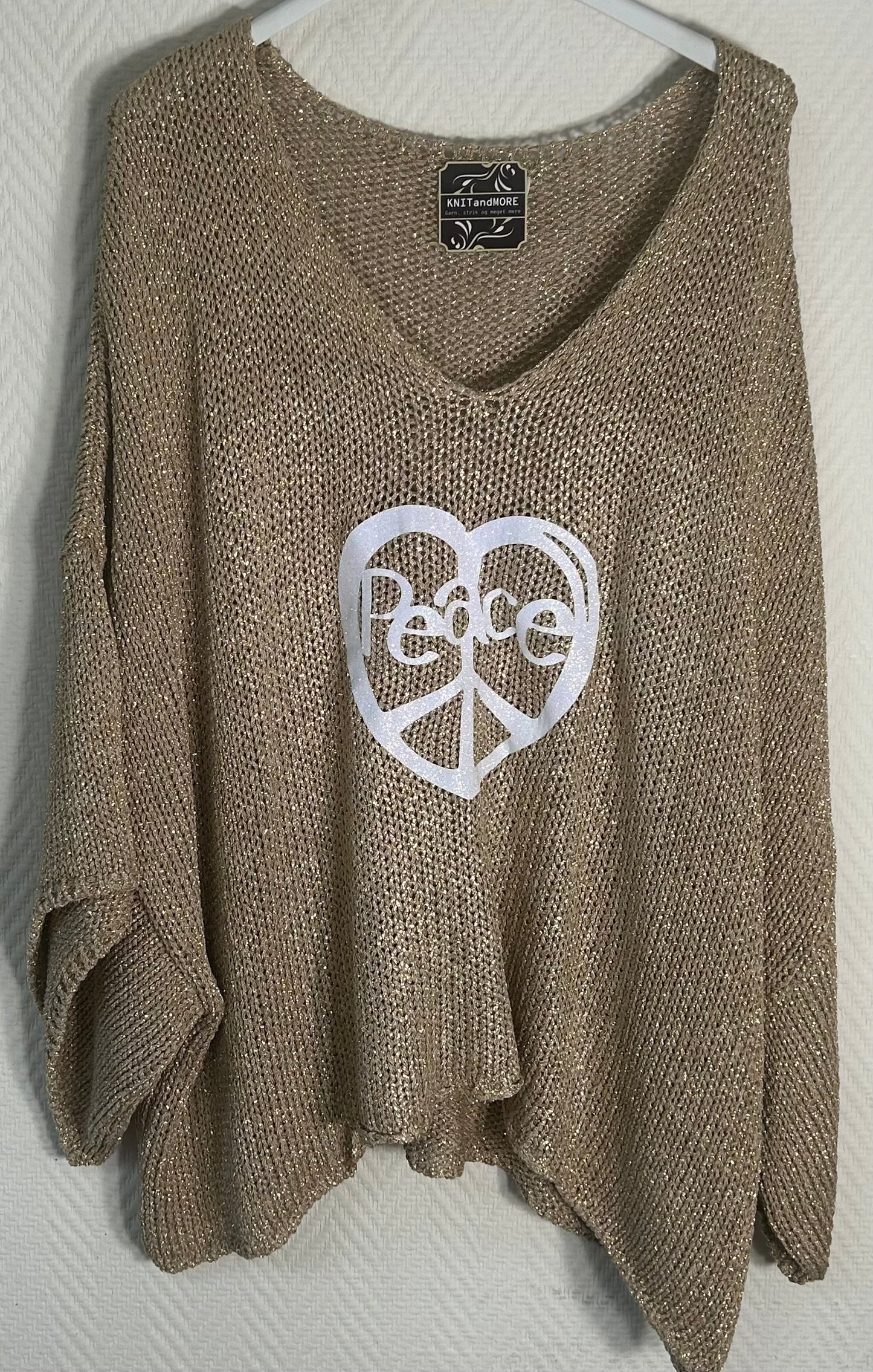 Onesize strikket bluse i effektgarn (lurex) med print